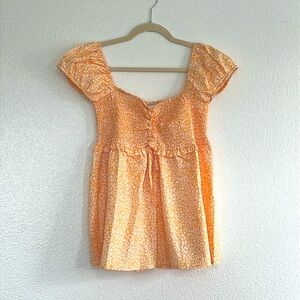 Yellow and white floral smocked bust top, size large